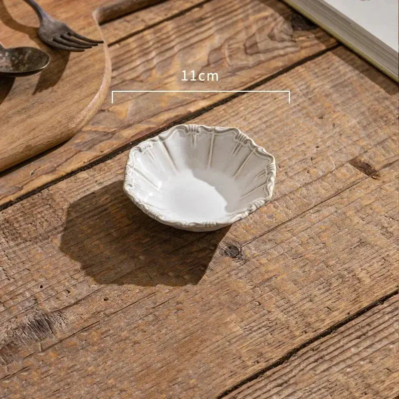 Small ceramic dish on a wooden surface with measurement