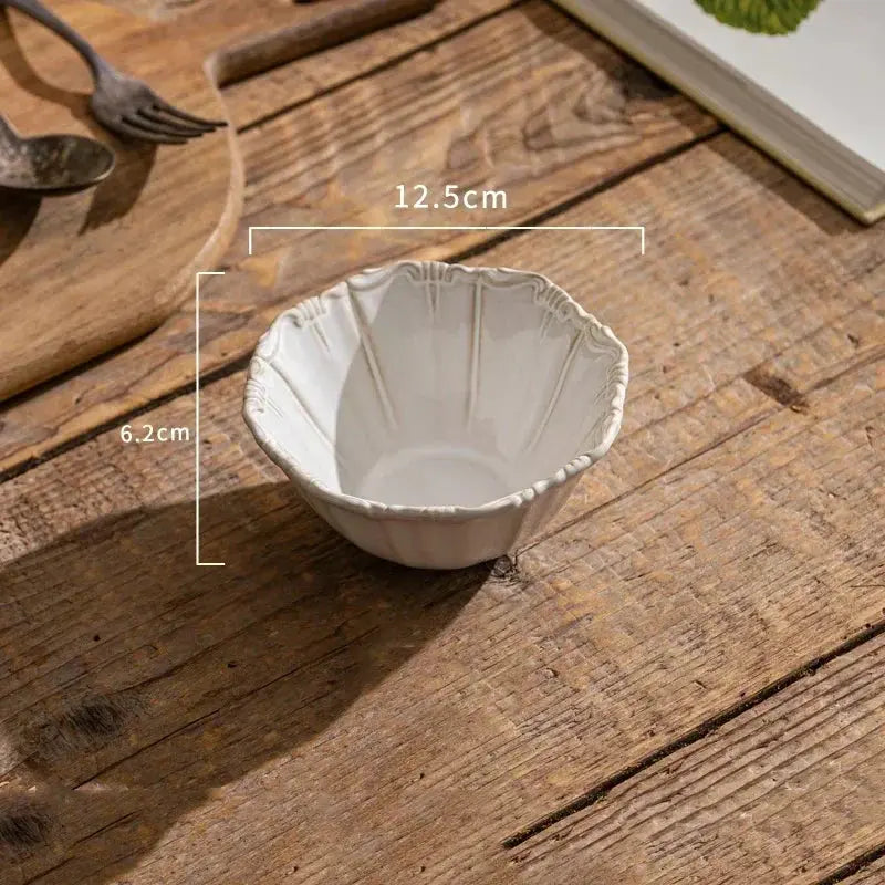 White ceramic bowl on a wooden surface with measurements