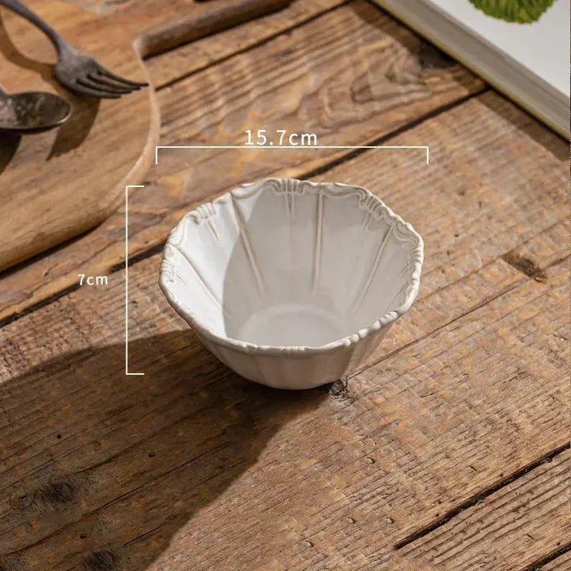 White ceramic bowl on a wooden surface with measurements