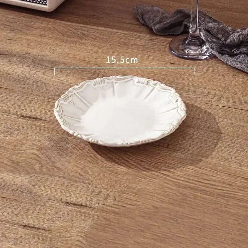 White decorative plate on a wooden surface with measurement