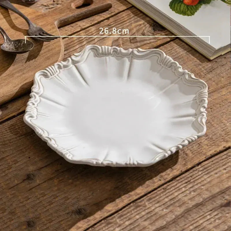White decorative plate on a wooden surface with measurement