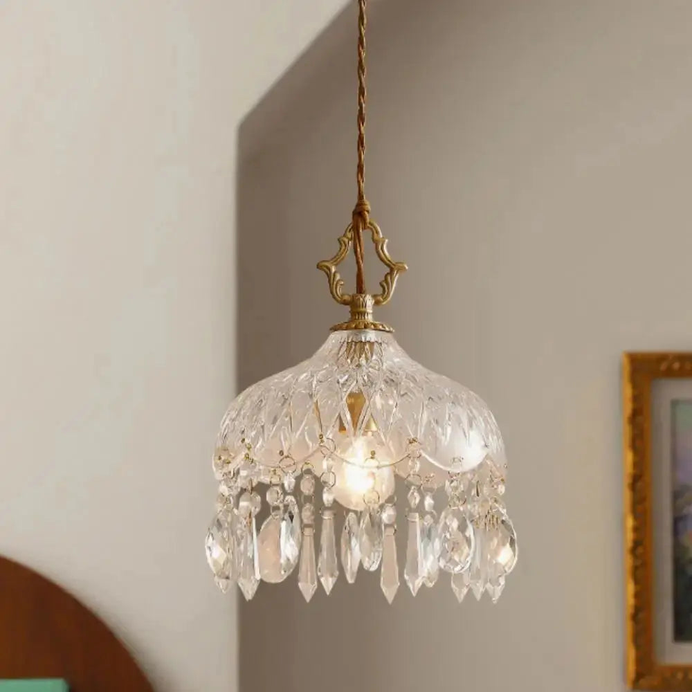 Crystal chandelier hanging against a neutral wall