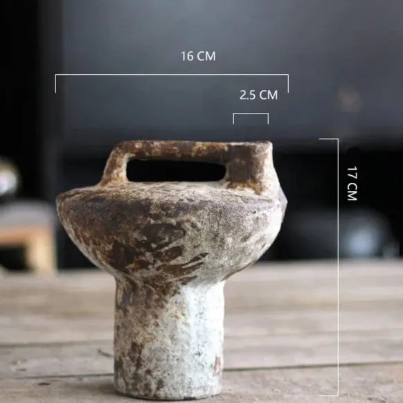 Rustic ceramic pot with measurements on a wooden surface