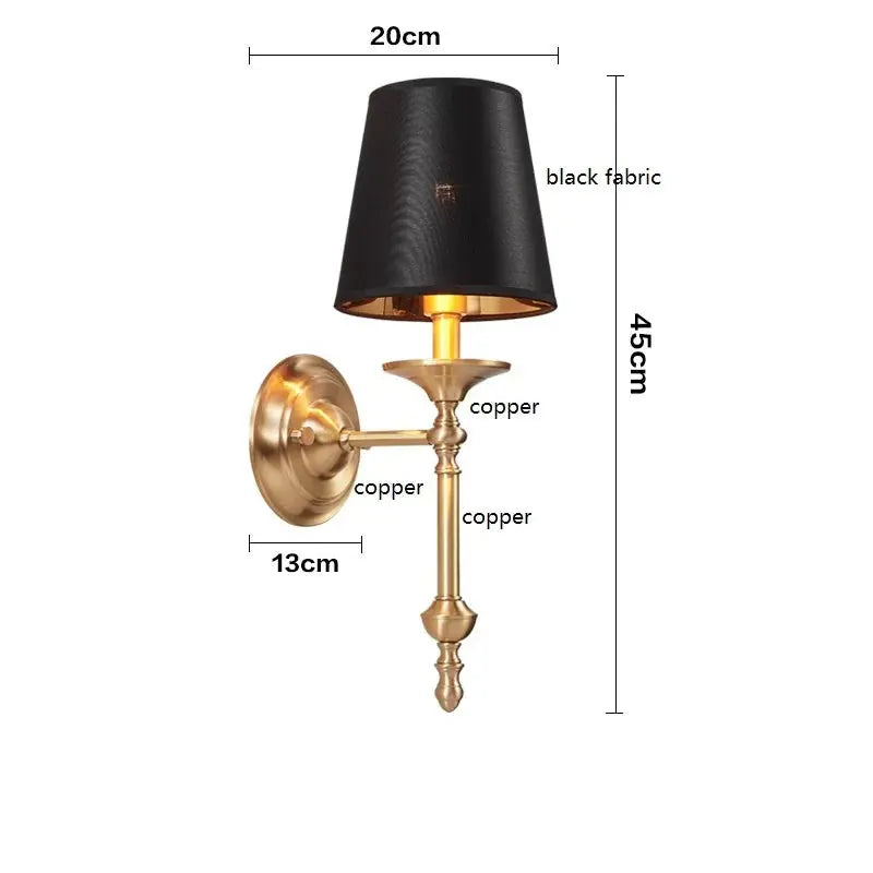 Wall lamp with black fabric shade and gold metal base