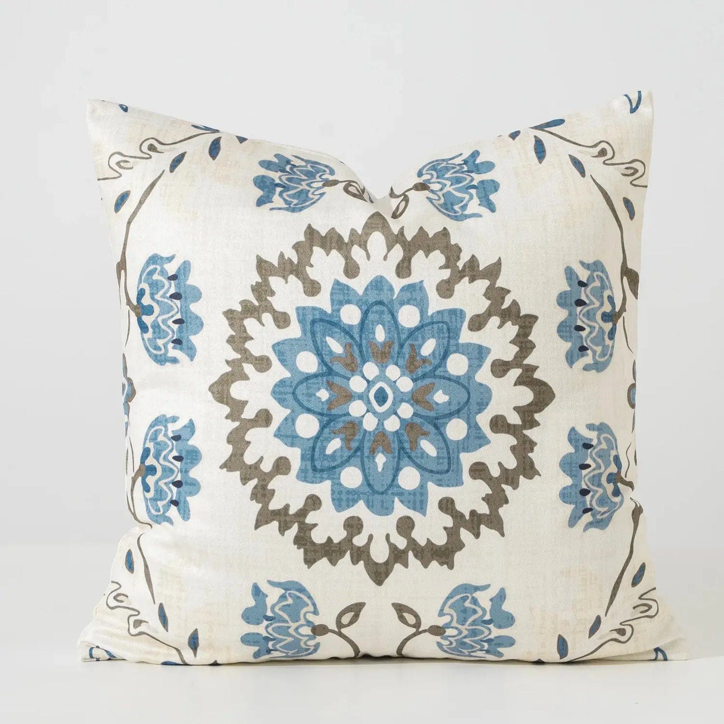 Decorative pillow with blue and brown floral pattern