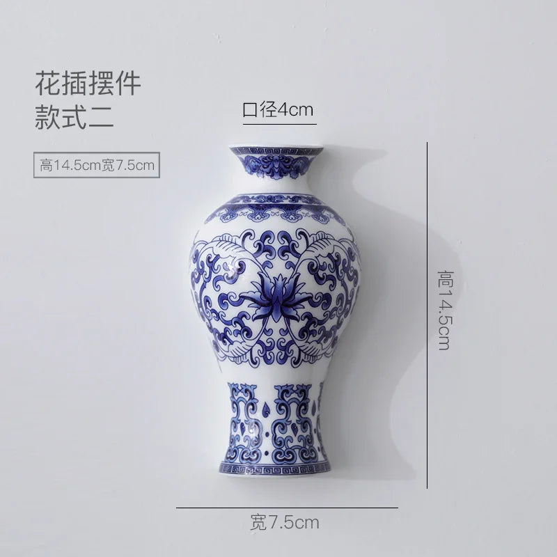 Blue and white ceramic vase with intricate patterns on a light gray background