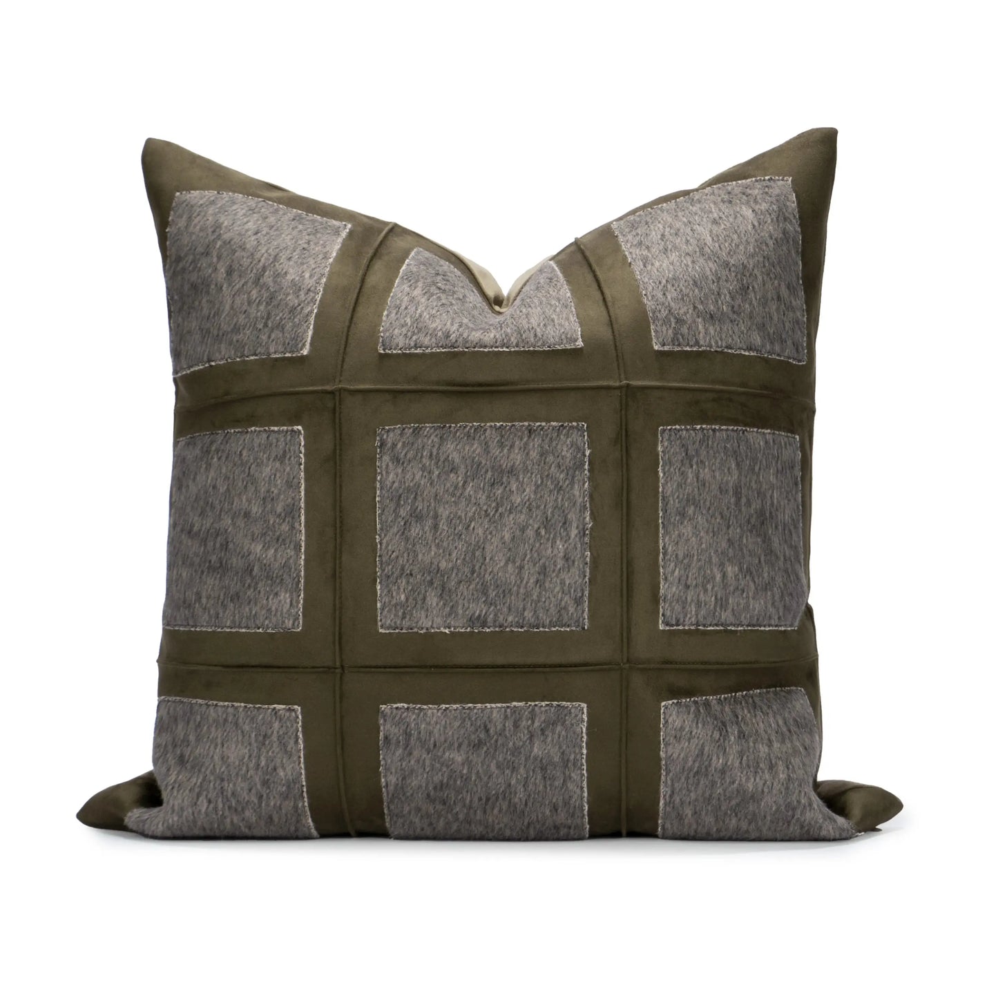 Decorative pillow with a patchwork design featuring gray and green colors on a white background.