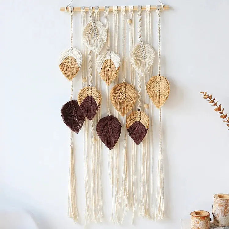 Decorative wall hanging with leaf-shaped beads and tassels