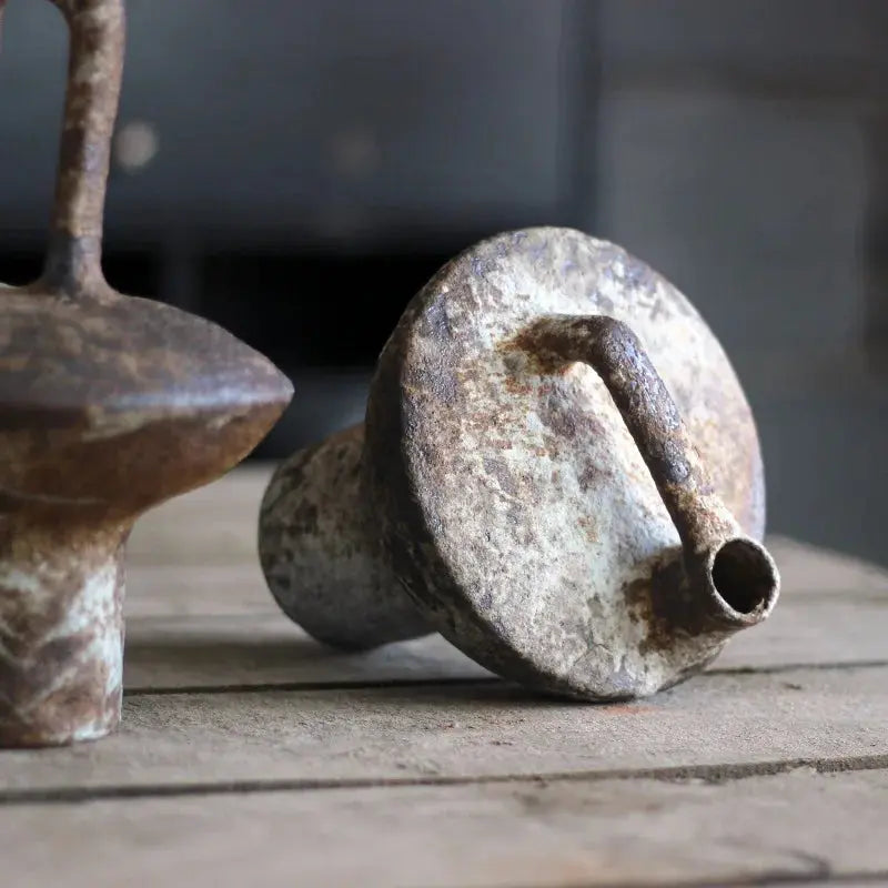Rustic metal objects on a wooden surface