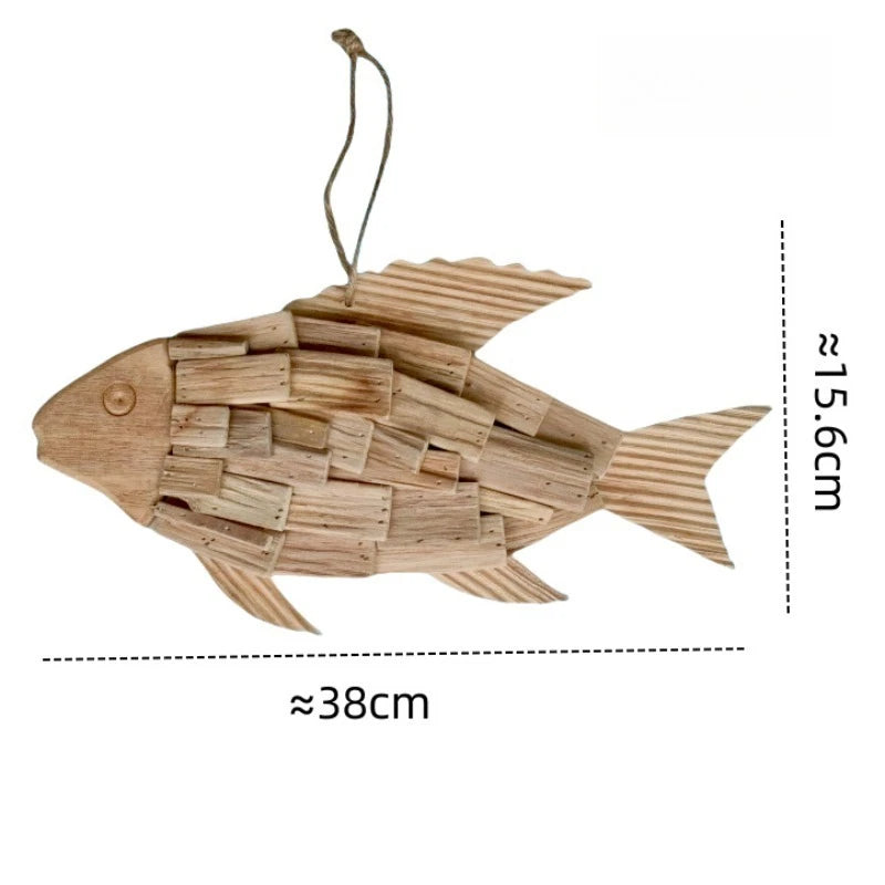 Wooden fish-shaped ornament with dimensions on a white background