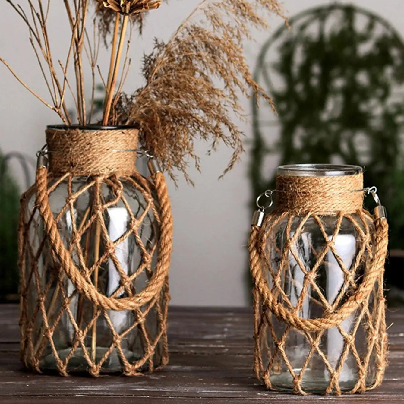 Two glass jars with rope detailing on a wooden surface