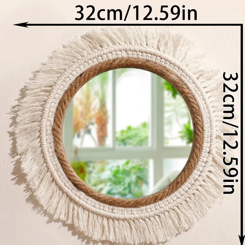 Round mirror with macrame fringe frame on a light background