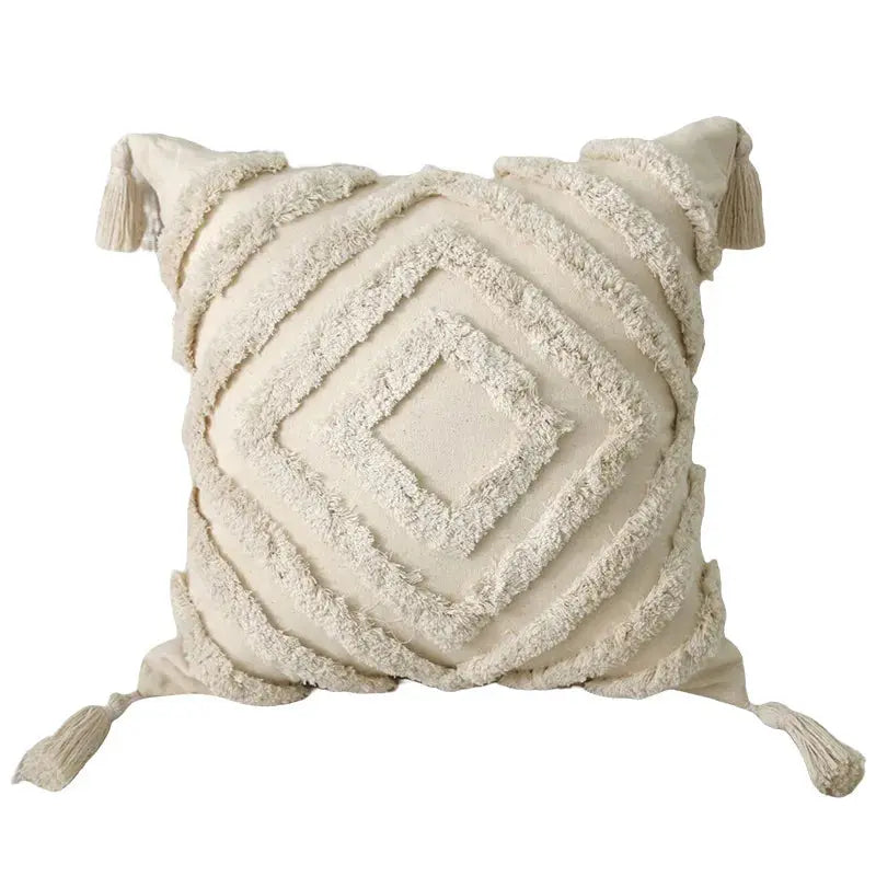 Decorative pillow with textured pattern and tassels