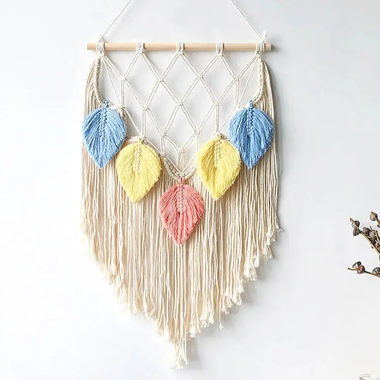 Macrame wall hanging with colorful leaf-shaped decorations