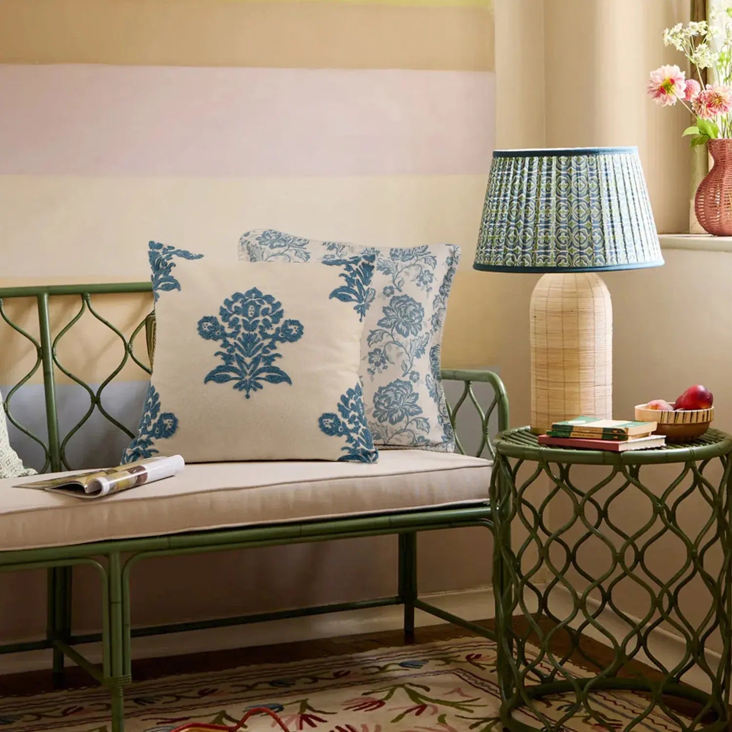 Living room with a green metal bench, decorative pillows