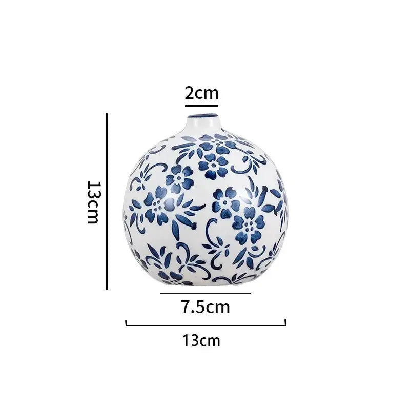 Ceramic vase with blue floral patterns and measurements