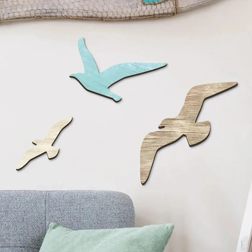 Wooden seagull wall decorations on a light-colored wall