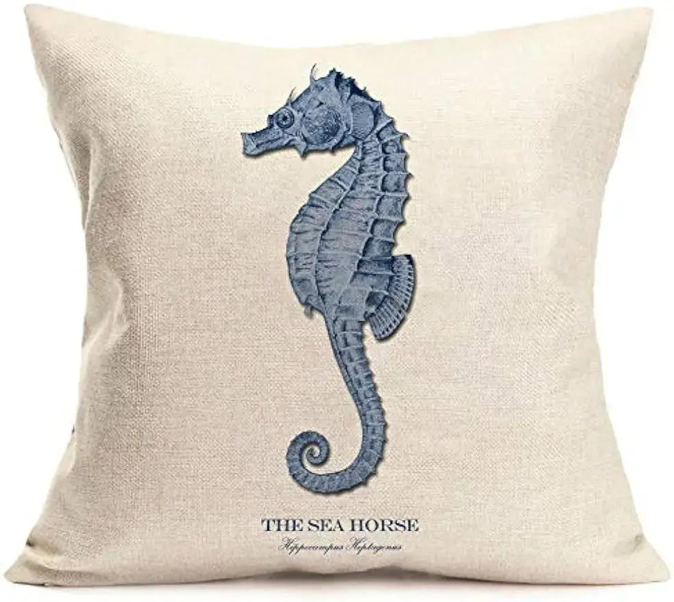 Decorative pillow with a blue seahorse design on a beige