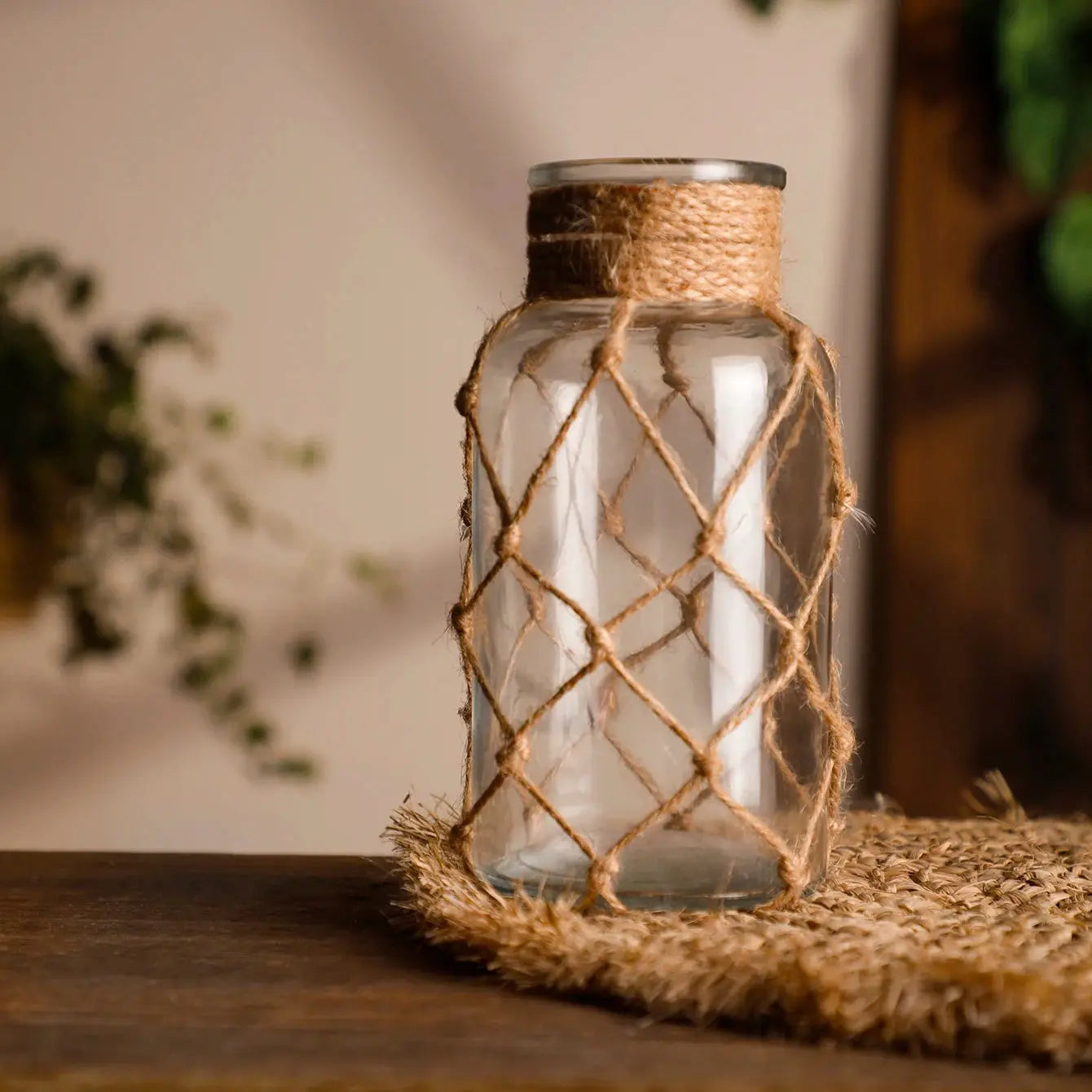 Decorative glass jar with woven rope