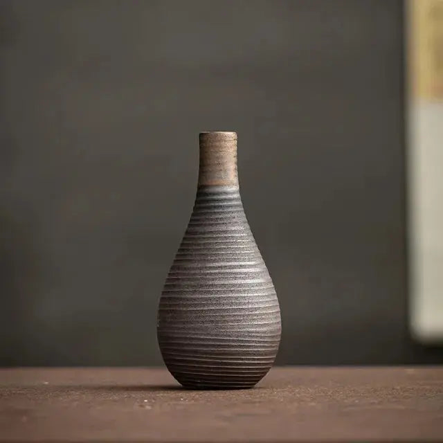 Textured ceramic vase on a wooden surface
