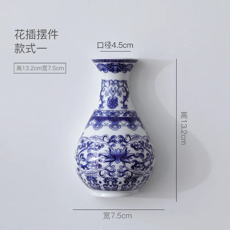 Blue and white ceramic vase with intricate patterns, shown with dimensions on a light gray background.