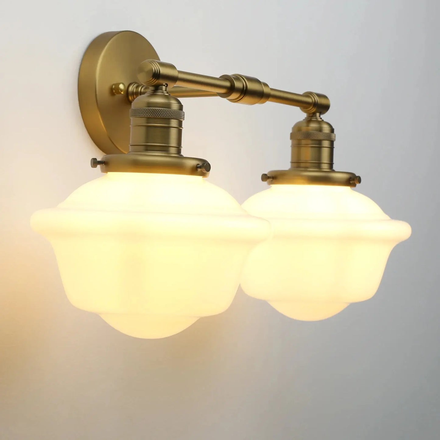 Vintage-style wall lamp with brass fixture and glass shades