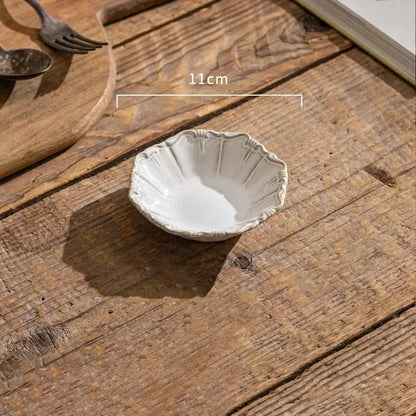 Small ceramic dish on a wooden surface with measurement
