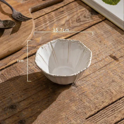 White ceramic bowl on a wooden surface with measurements