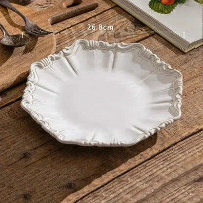 White decorative plate on a wooden surface with measurement