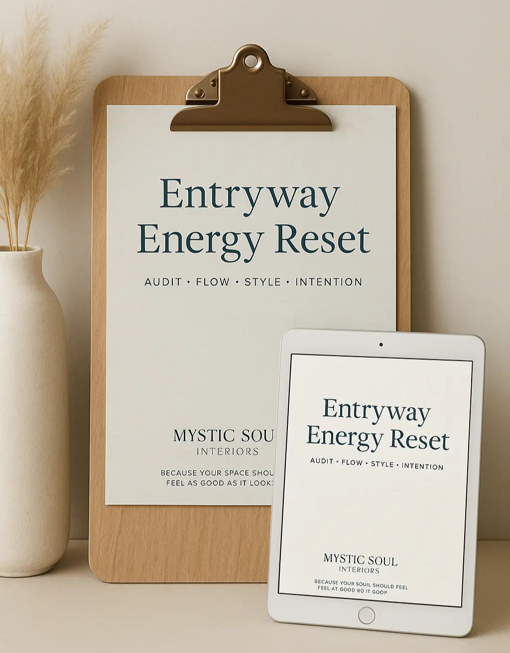 Clipboard with 'Entryway Energy Reset' sign and tablet displaying the same text on a neutral background.