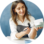woman painting a cup