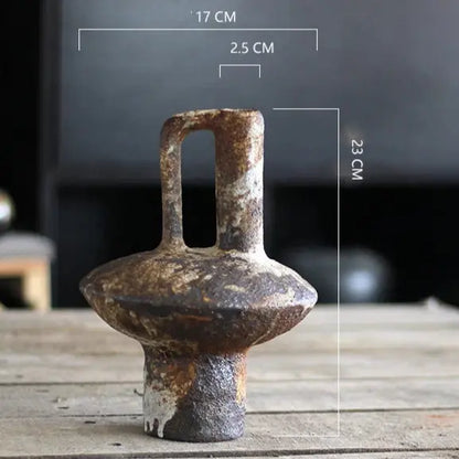 Rust-colored metal object on a wooden surface 