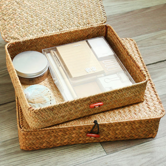 Woven storage box with items on a wooden surface