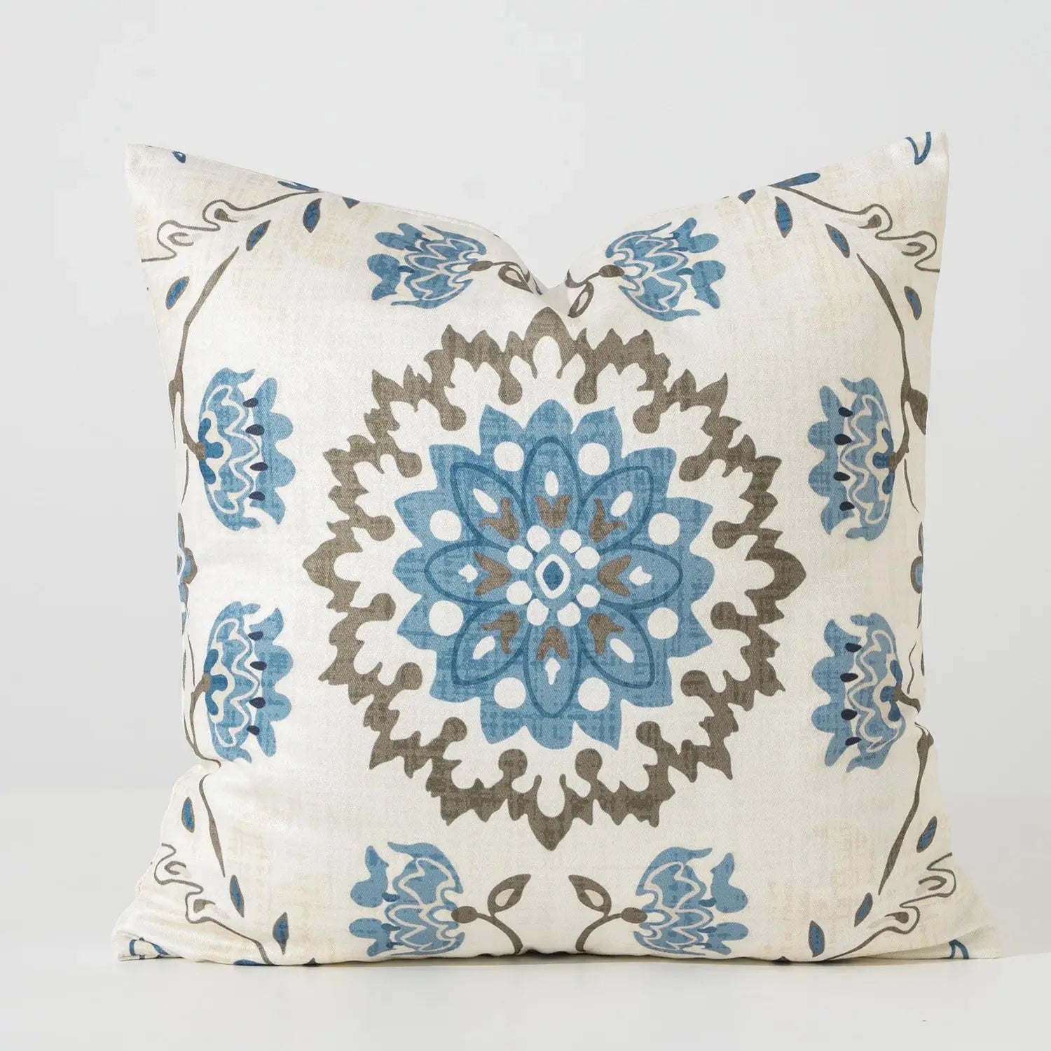 Decorative pillow with blue and brown floral pattern