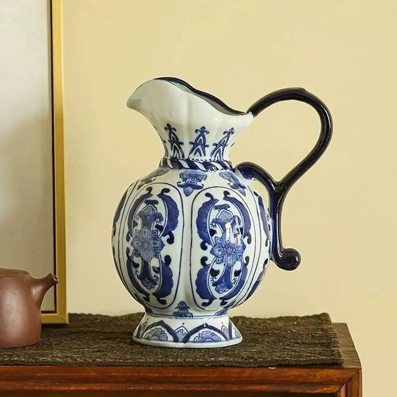 Ceramic pitcher with blue and white floral patterns