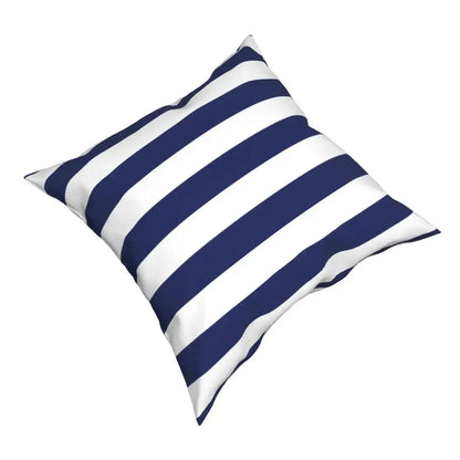Navy and white striped pillow on a white background