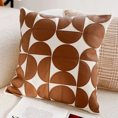 Decorative pillow with brown circular pattern on a couch