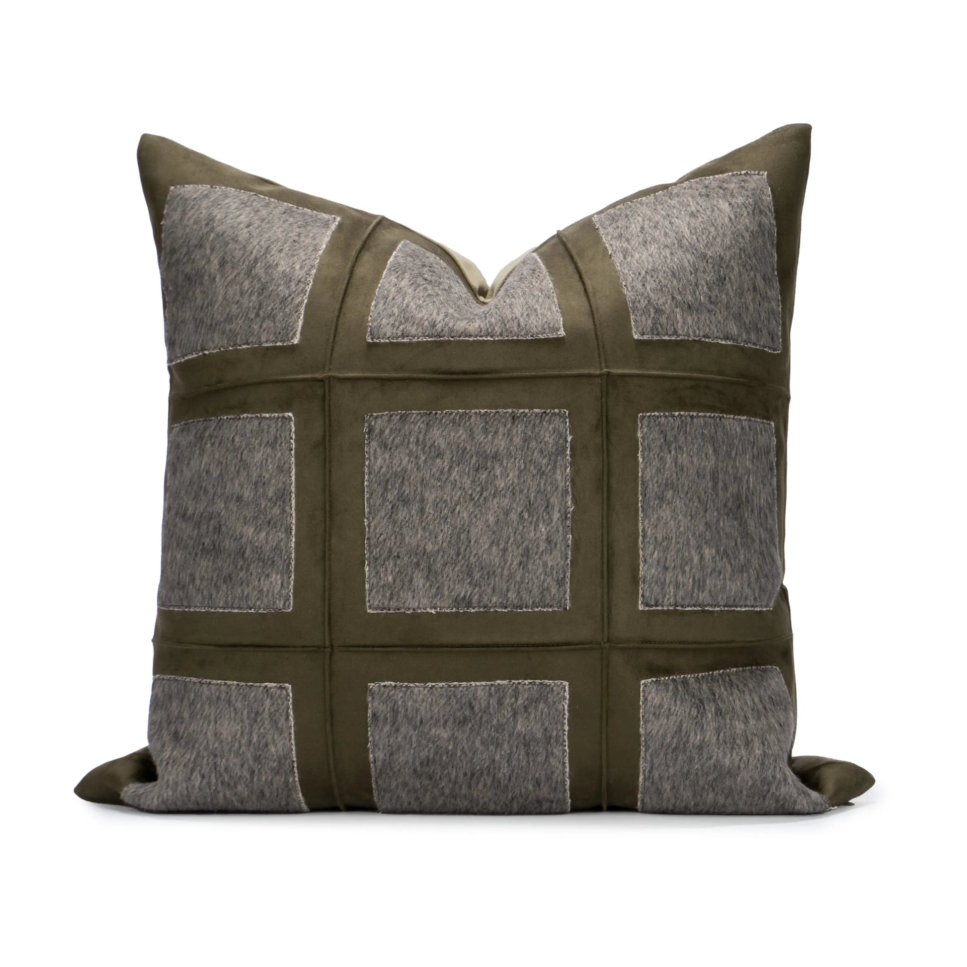 Decorative pillow with a patchwork design featuring gray and green colors on a white background.