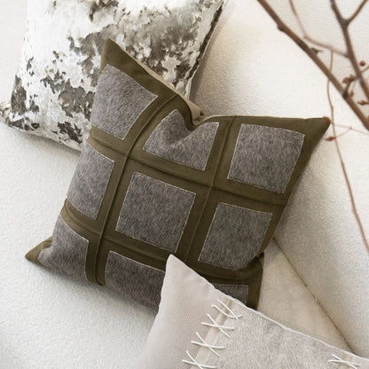 Decorative pillow with geometric pattern on a neutral background