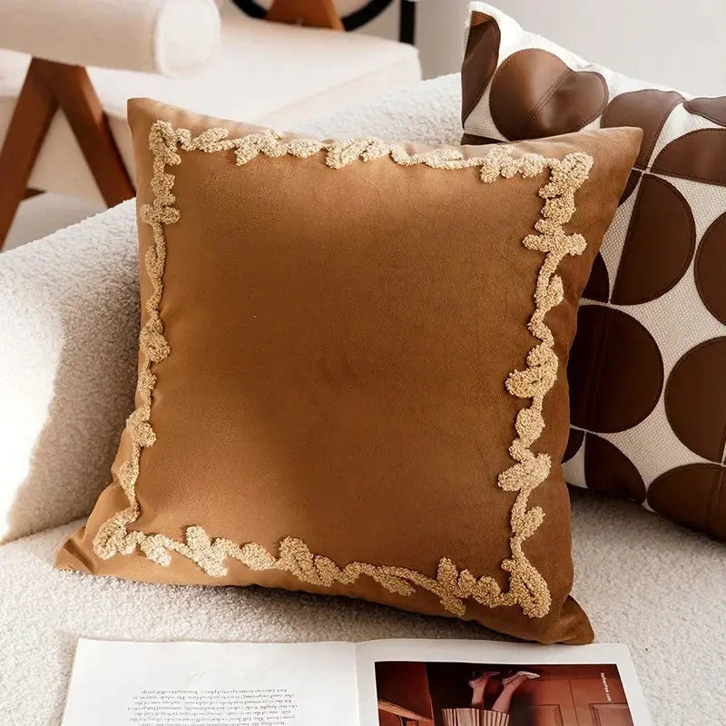Brown pillow with decorative trim on a couch