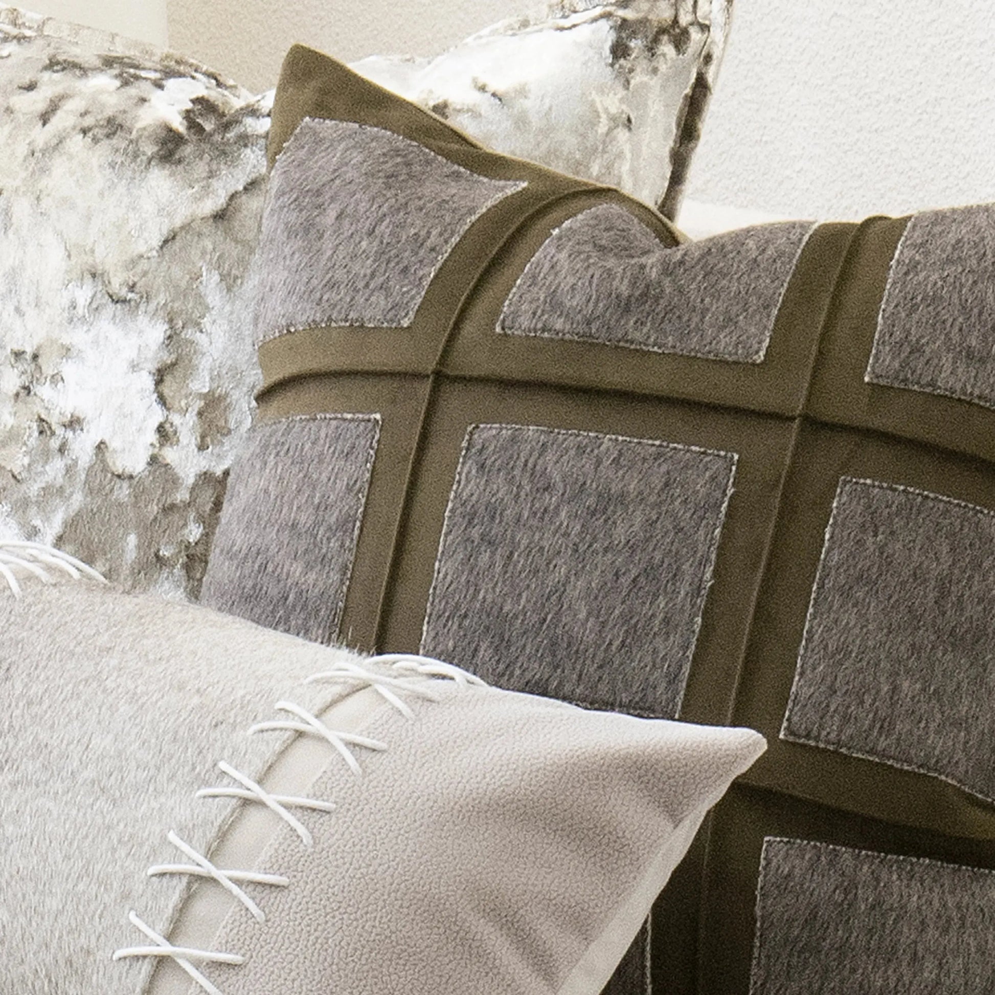 Close-up of decorative pillows with geometric pattern and textured surface.