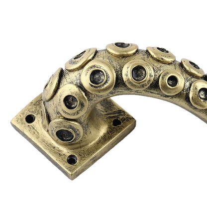 Bronze octopus tentacle handle on a white background