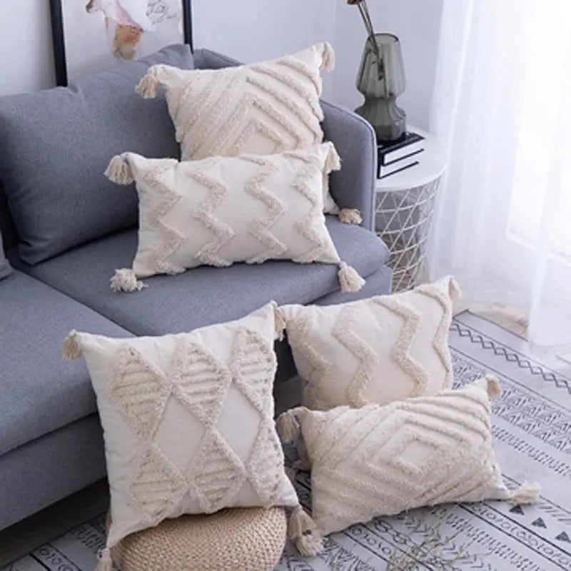 Decorative pillows on a gray sofa in a living room setting