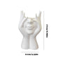 White vase shaped like a face with measurements on a white background