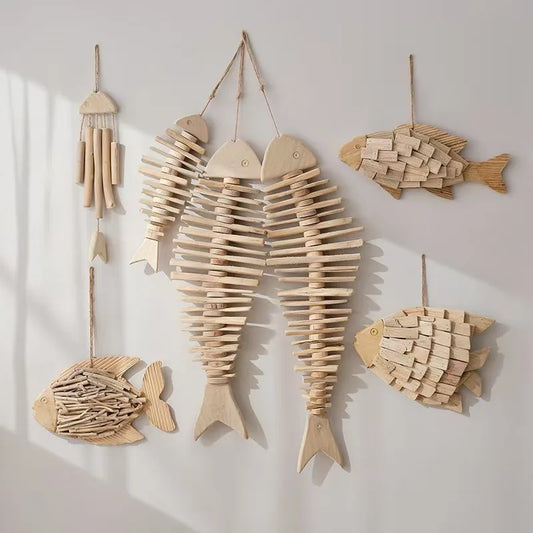 Wooden fish-shaped wall decorations on a light background