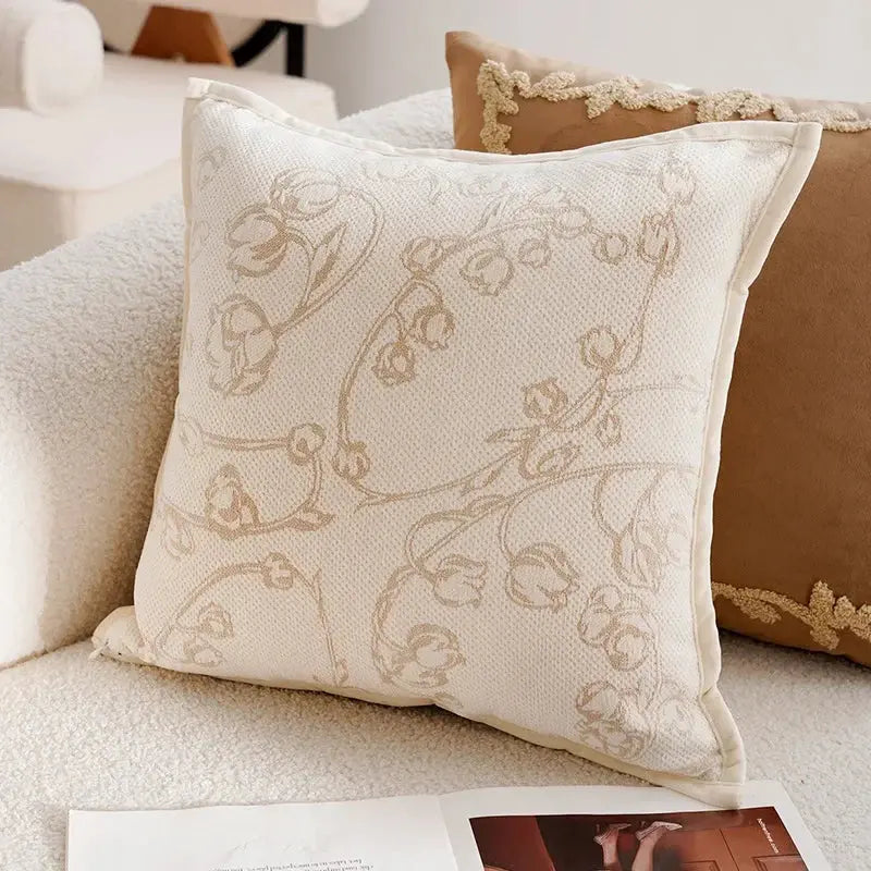 Decorative pillow with floral pattern on a sofa
