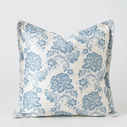 Floral patterned pillow with blue flowers
