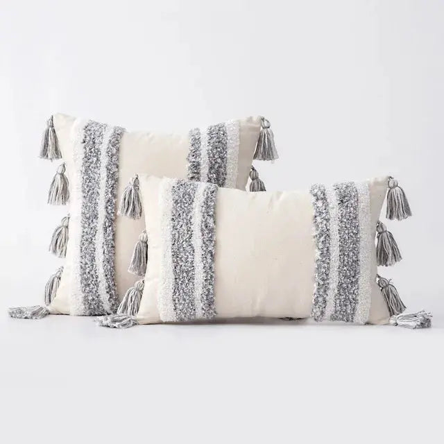 Decorative pillows with tassels on a white background