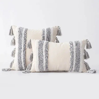 Decorative pillows with tassels on a white background