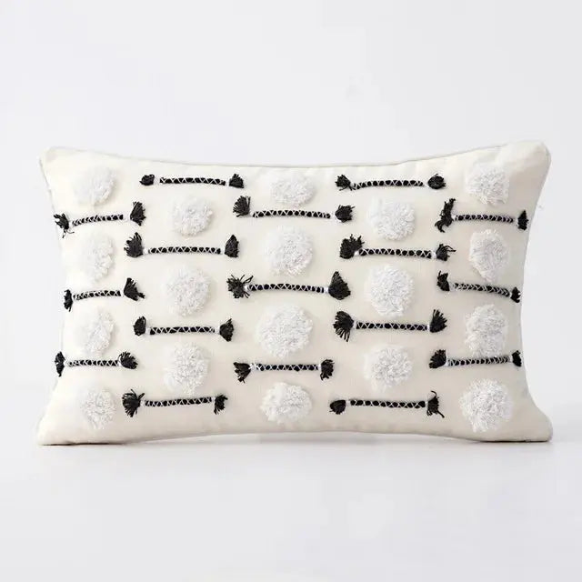 Decorative pillow with black and white pattern on a white background
